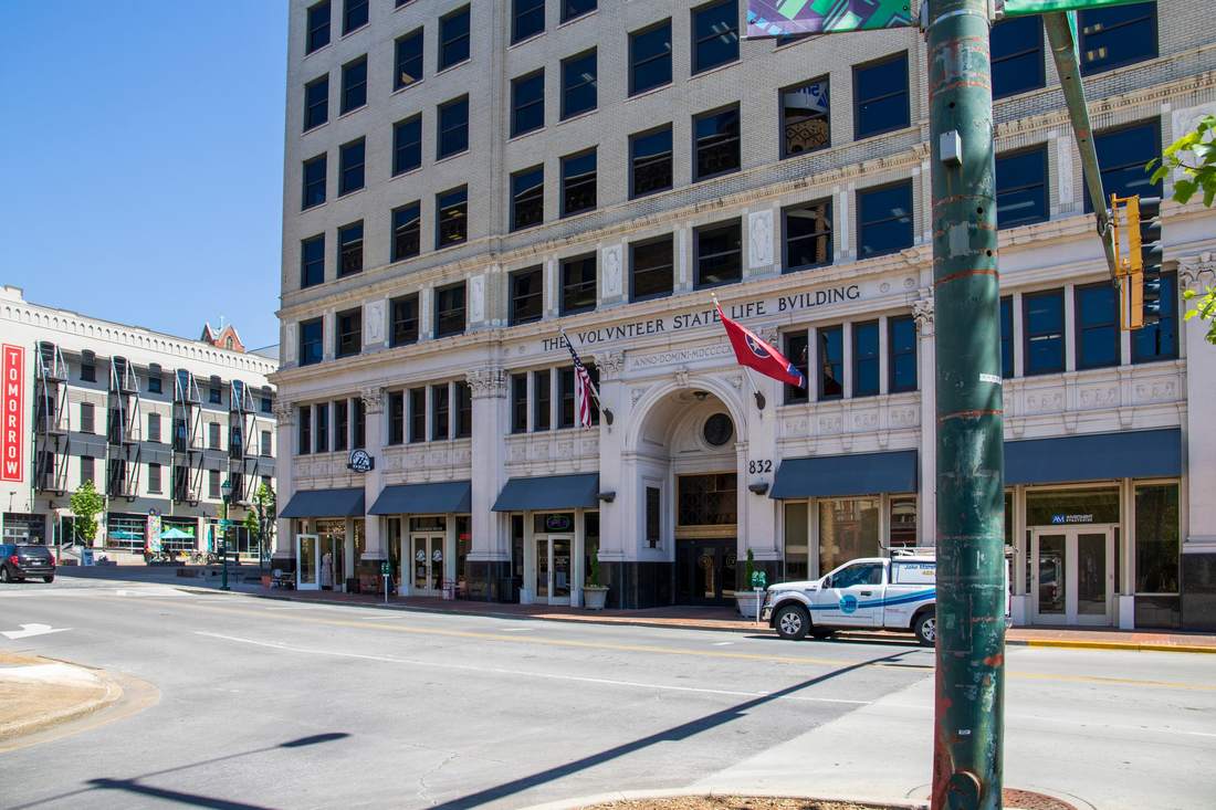 Street-level view of the arched entrance of the Volunteer Building in downtown Chattanooga